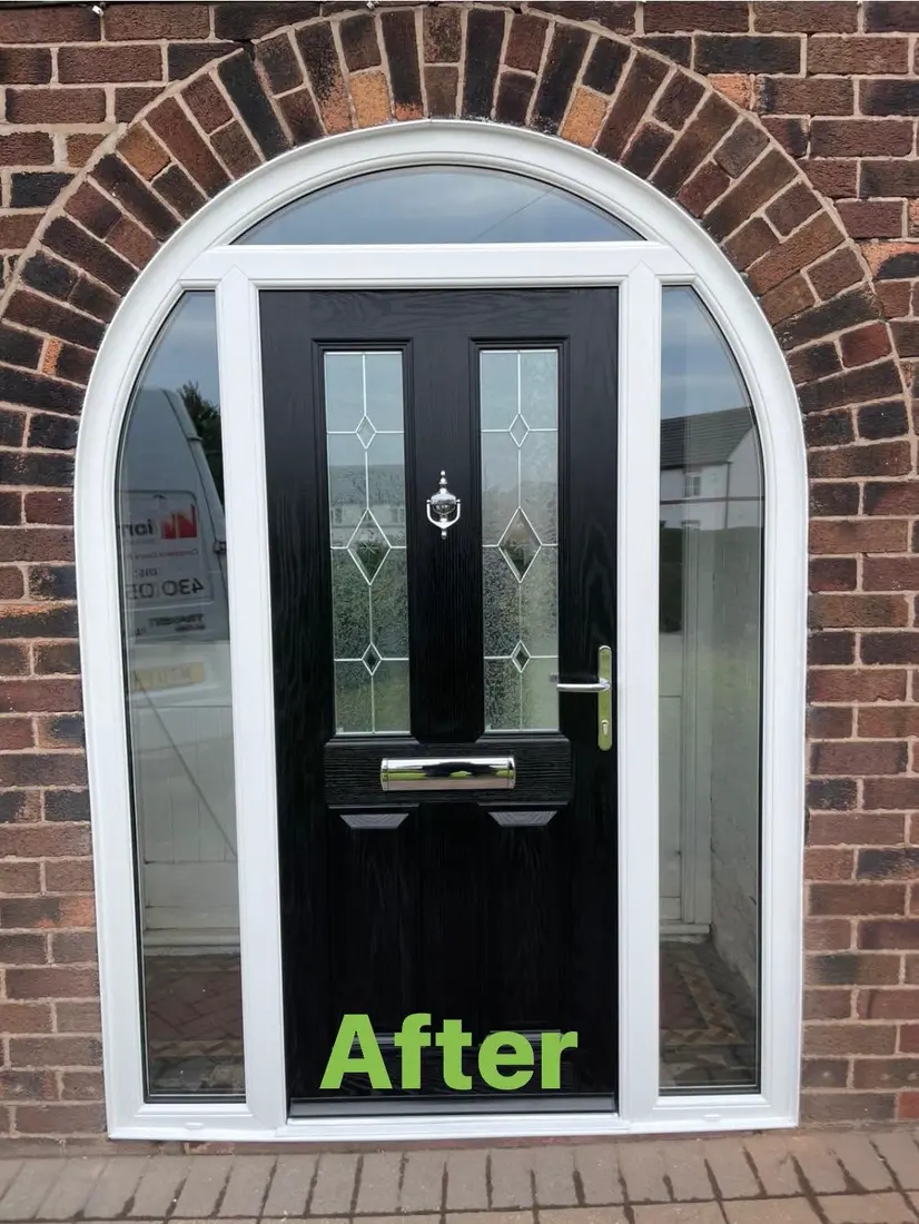 After: The same arch with a new black composite door and white arched frame